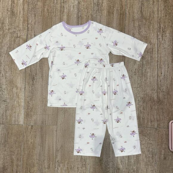 Lavender Fairy Dreams pajamas flat lay on wooden floor