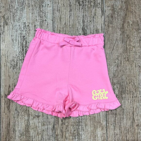Flat lay of Pink Bloom girls cotton shorts with ruffled hem
