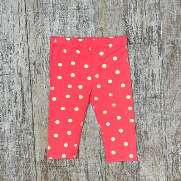 Coral gold polka dot baby leggings flat lay