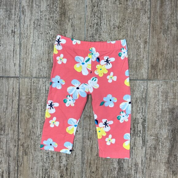 Coral floral baby leggings flat lay